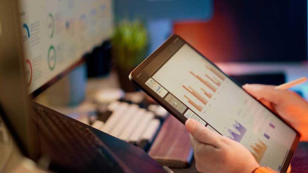 Person analyzing data on a tablet representing solo business operations