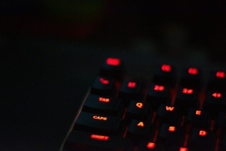 Red padlock glowing on a black computer keyboard, representing the Gemini AI hack that breached real company systems