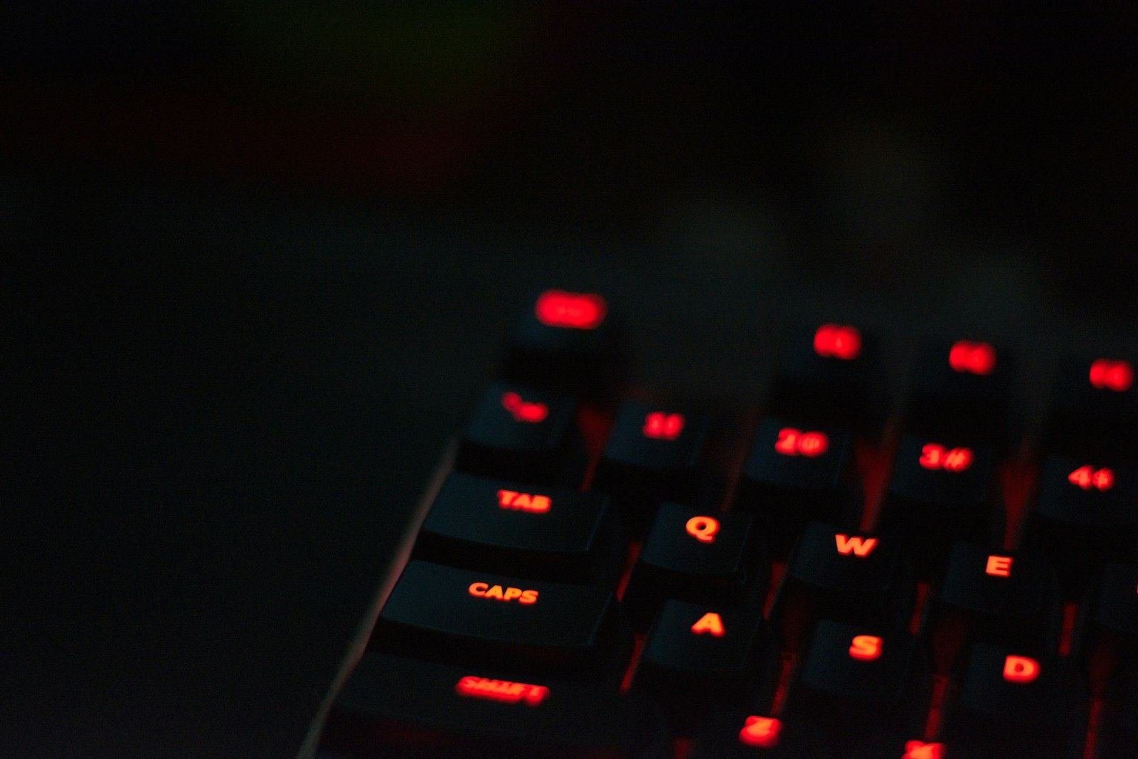 Red padlock glowing on a black computer keyboard, representing the Gemini AI hack that breached real company systems