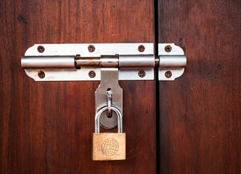 A padlock securing a bolt, representing the IDScan data breach exposing driver license records