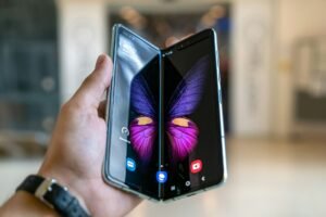 A folded smartphone device, illustrating the book-style form factor Apple adopted for the iPhone Duo