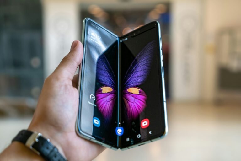 A folded smartphone device, illustrating the book-style form factor Apple adopted for the iPhone Duo