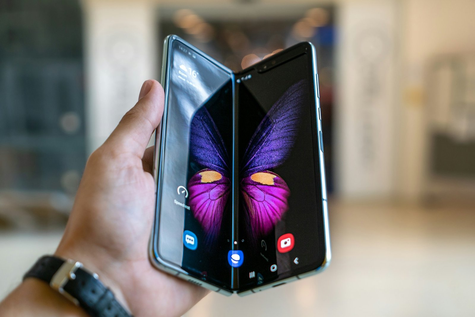 A folded smartphone device, illustrating the book-style form factor Apple adopted for the iPhone Duo