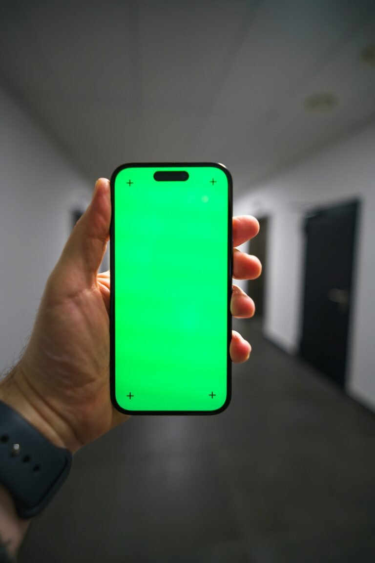 Hand holding a smartphone, representing the upcoming iPhone Fold launch