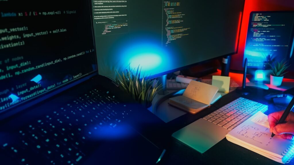 Computer screens displaying code, representing Meta Muse Spark 1.3 coding model pricing tiers
