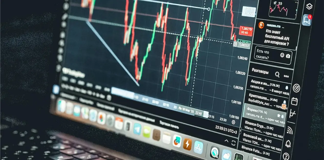 Laptop displaying a stock market trading chart, representing the OpenAI IPO delay