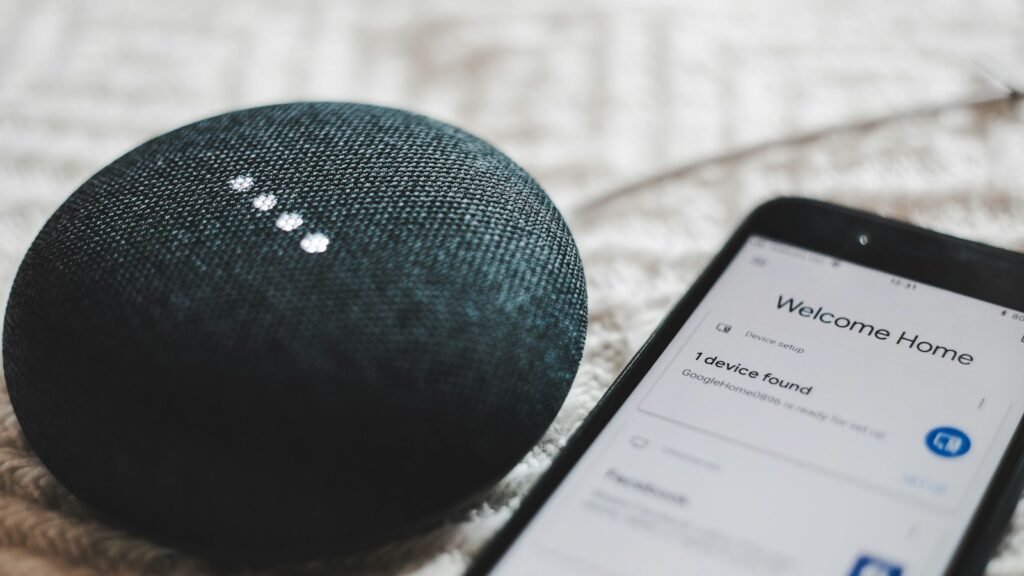 A smart speaker and smartphone, representing the debate over AI consciousness raised by groups like UFAIR